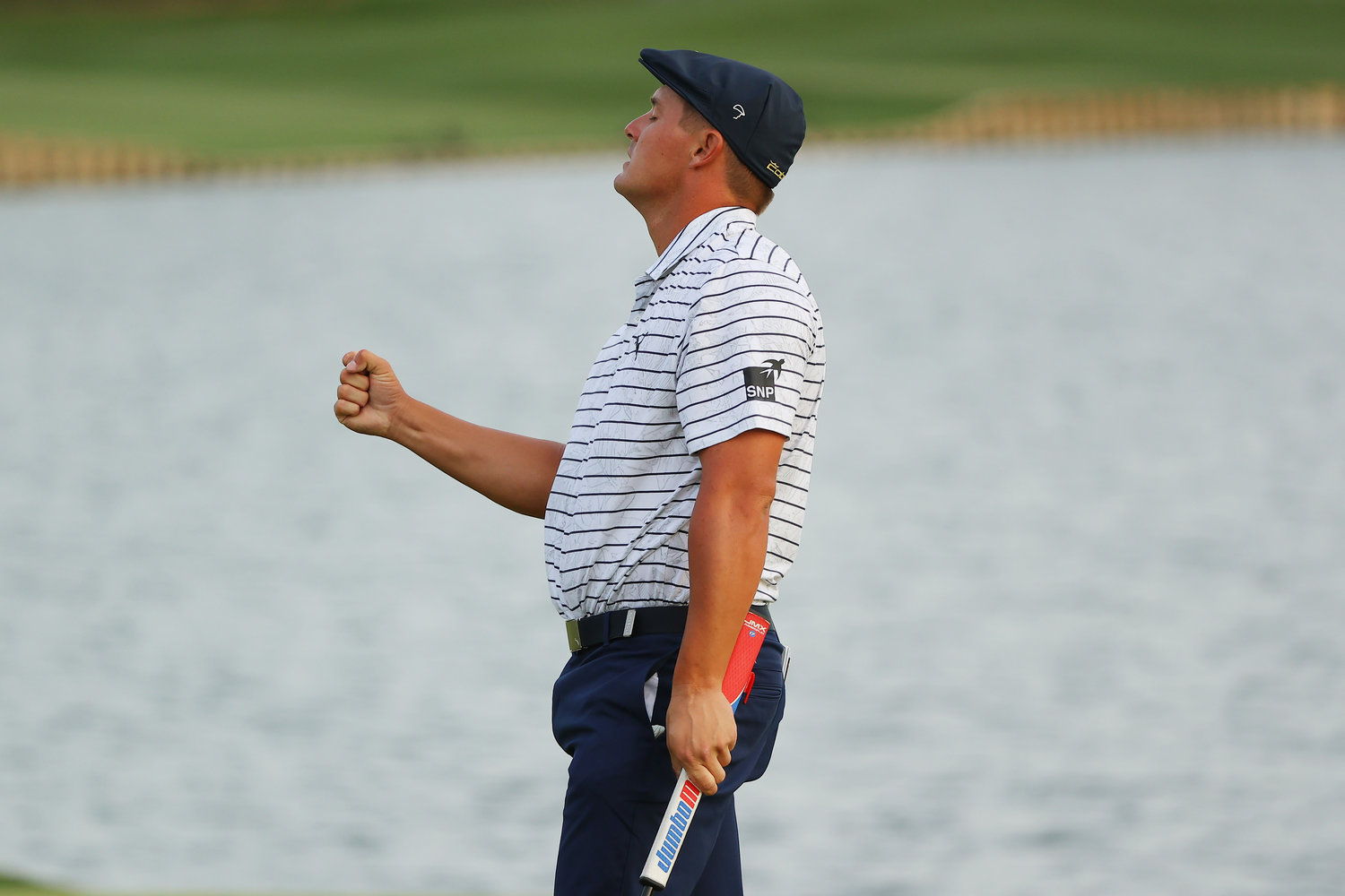 PONTE VEDRA BEACH, FLORIDA - MARCH 13: Bryson DeChambeau of the United States celebrates after finishing on the 18th green during the third round of THE PLAYERS Championship on THE PLAYERS Stadium Course at TPC Sawgrass on March 13, 2021 in Ponte Vedra Beach, Florida. (Photo by Kevin C. Cox/Getty Images)