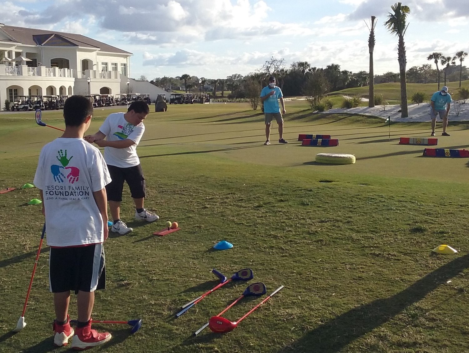 Young golfers test their chipping skills during the Tesori Family Foundation All-Star Kids Clinic on March 10.