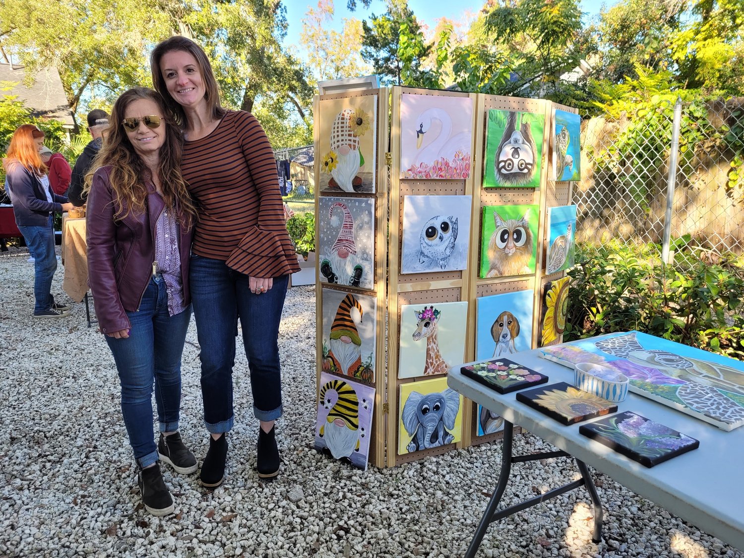 Artist Eleanor Crosby, left, and Dr. Carla Rodrigues at the Artisans Market fundraiser for Celestial Farms.