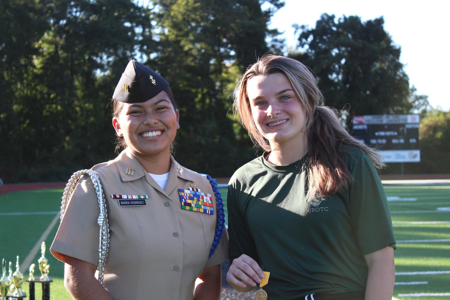 Cadet Lt. Emmelie Neff receives one of her three first-place sit-up medals. Neff averaged 331 sit-ups during competition at the Sprayberry, Lee County. Martin Luther King High School hosted meets.