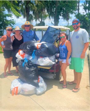Three families collected trash to overflowing from the area around the Palatka Crystal Cove Marina.