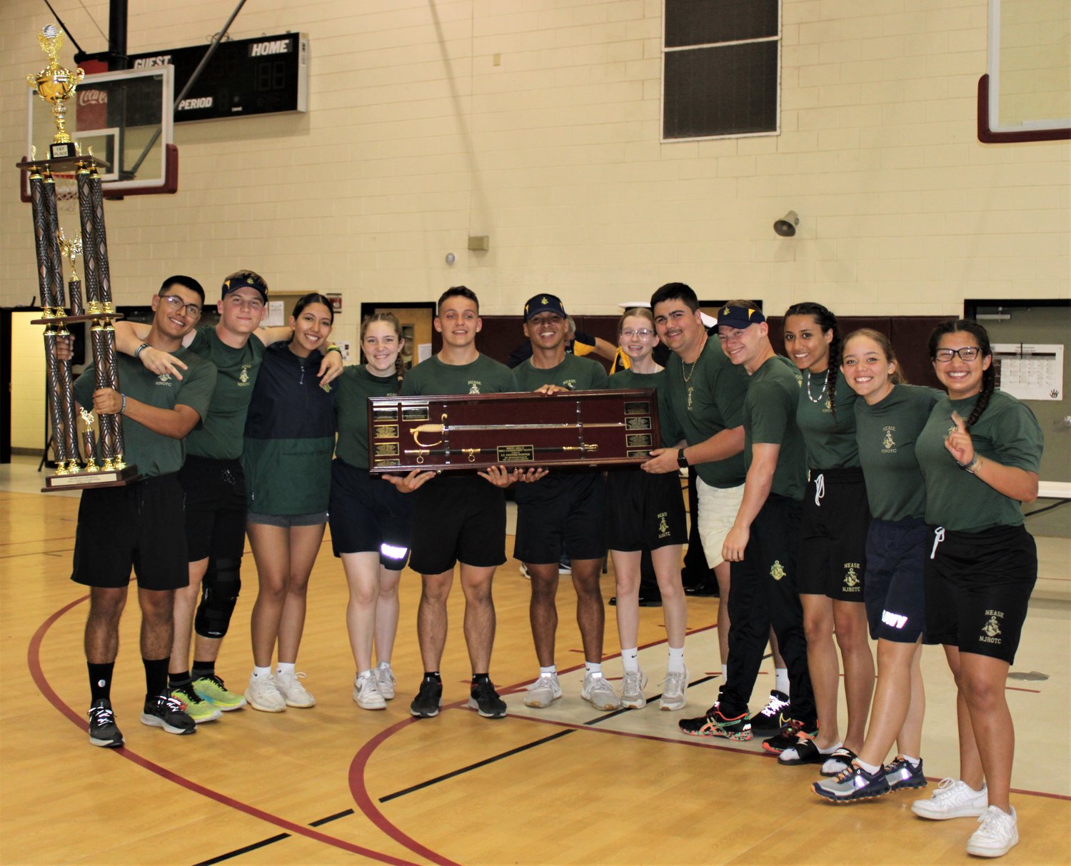 The Nease NJROTC Senior Cadets accept the overall first place trophy at the Area 12 Drill Championships March 5.